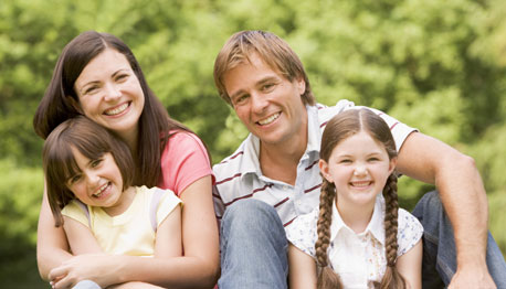 smiling family outside