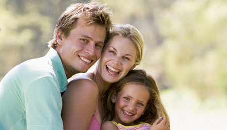 smiling family outside